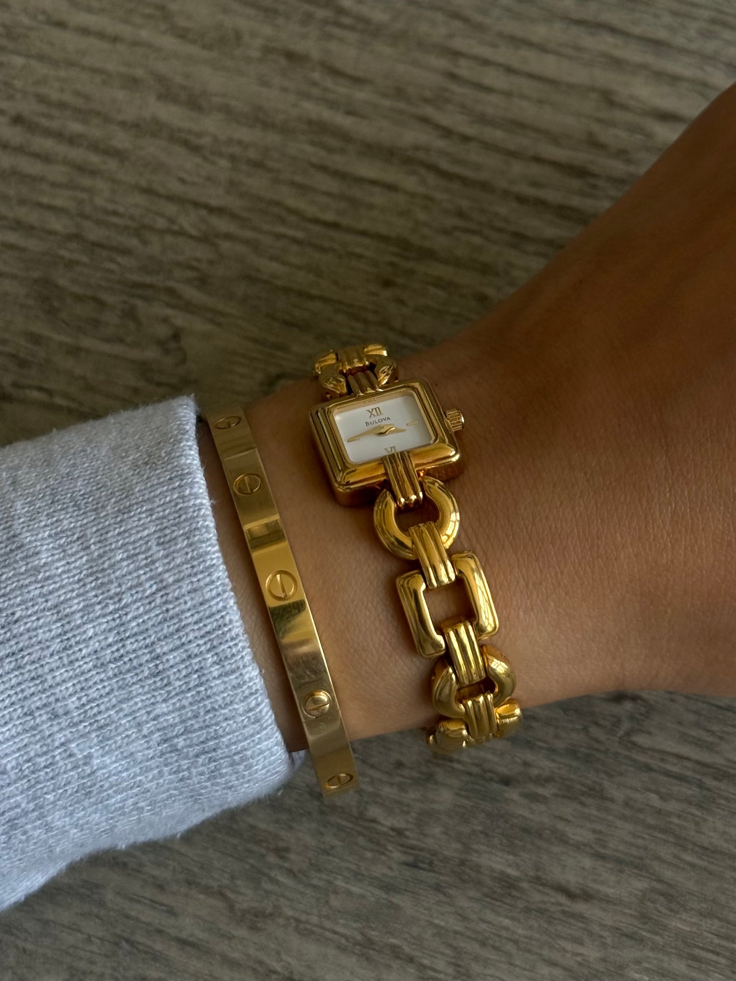 Classic Gold Toned Bulova Watch with White Square Face