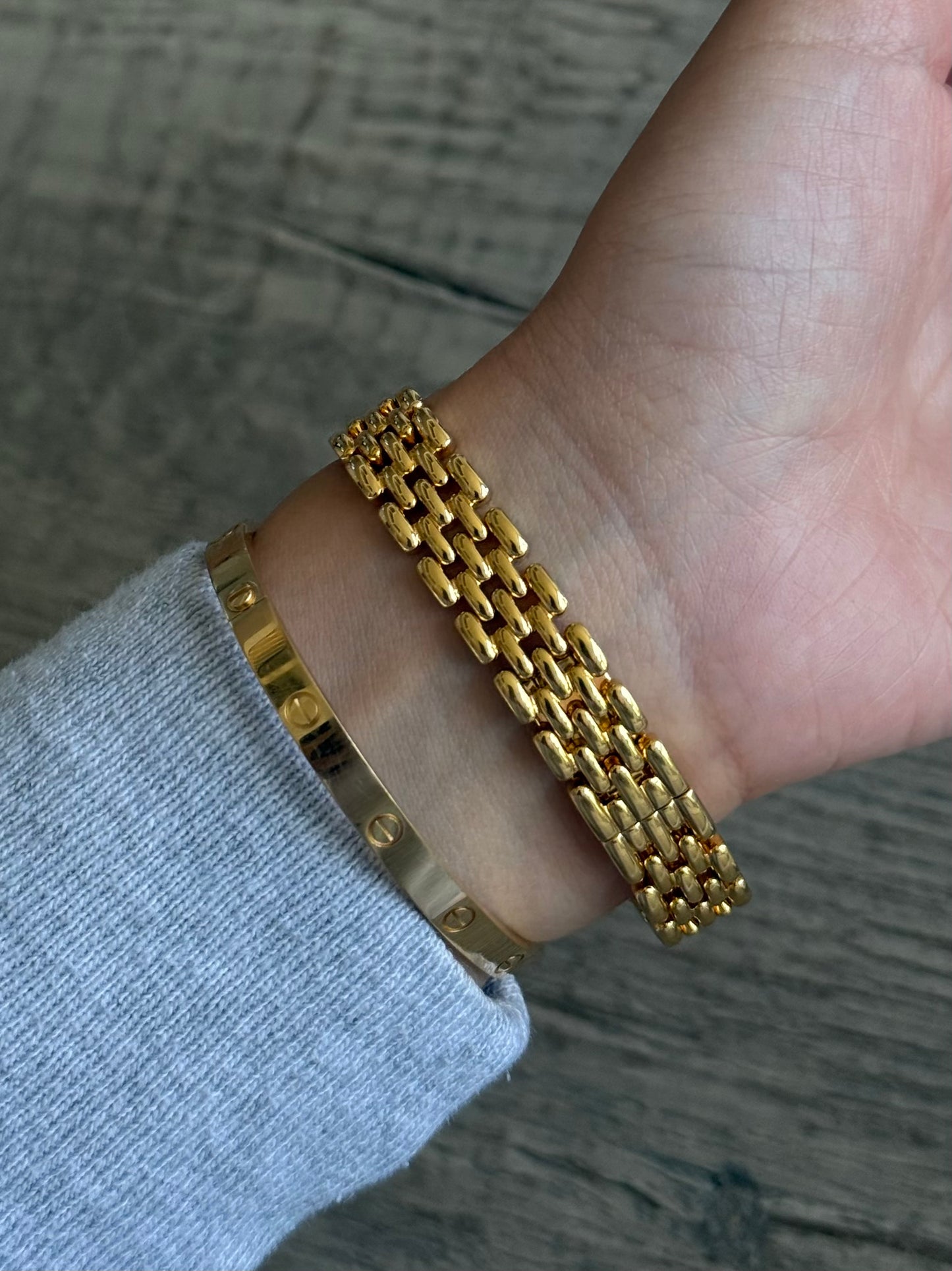 Nina Ricci Gold Toned Watch with Bow Bezel Set