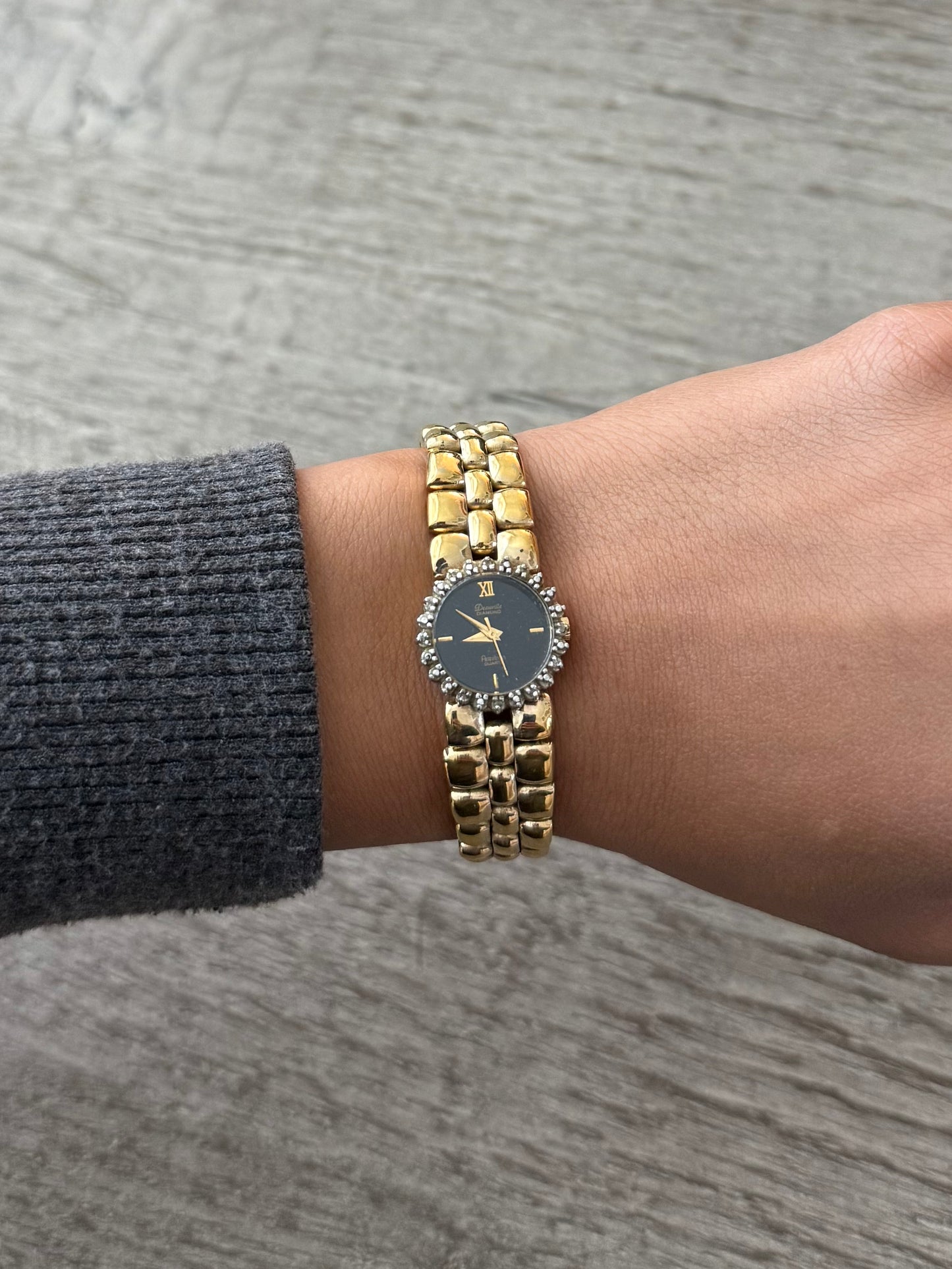 Gold Toned Armitron Dark Dial Watch with Crystal Bezel