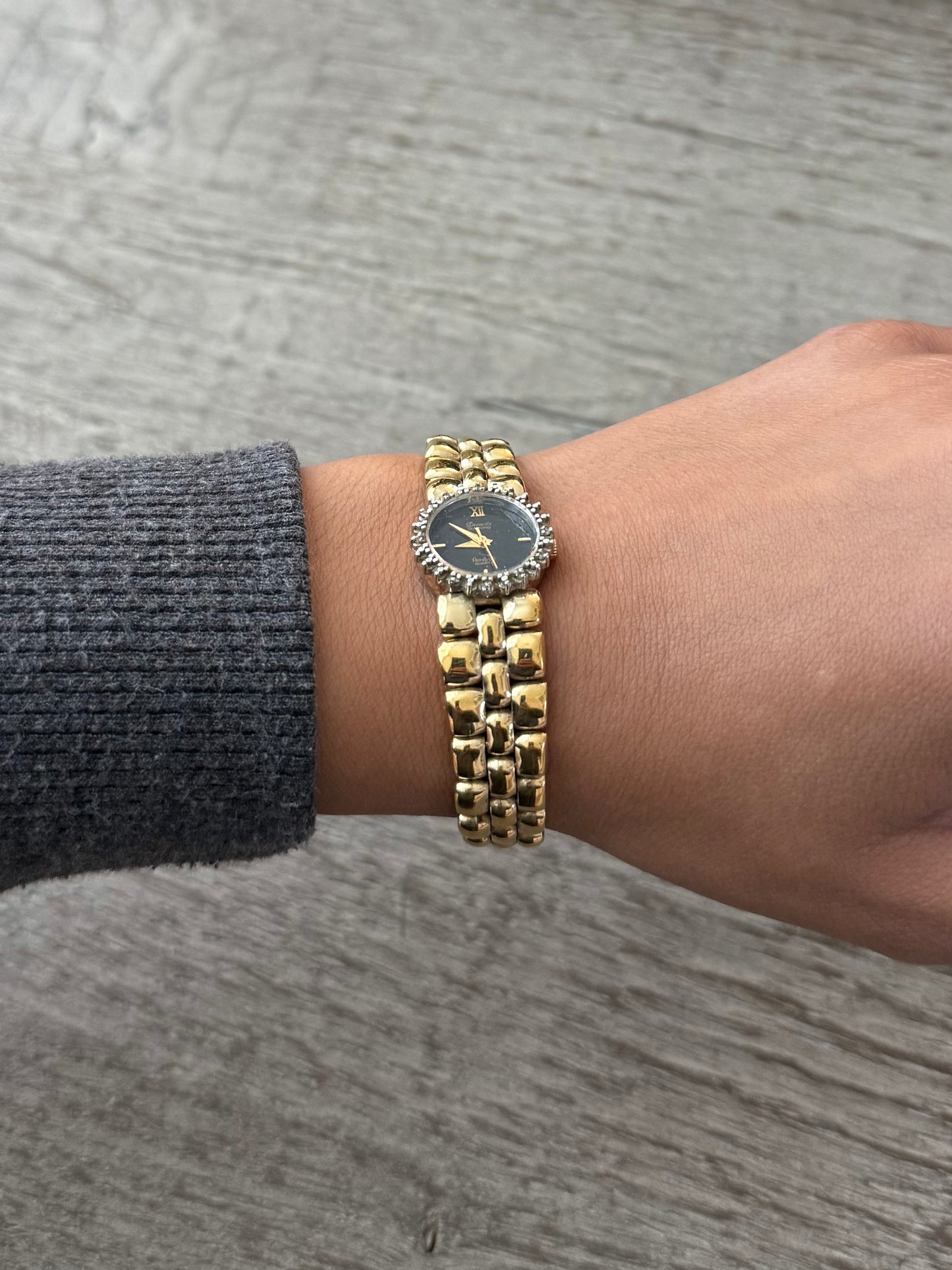 Gold Toned Armitron Dark Dial Watch with Crystal Bezel