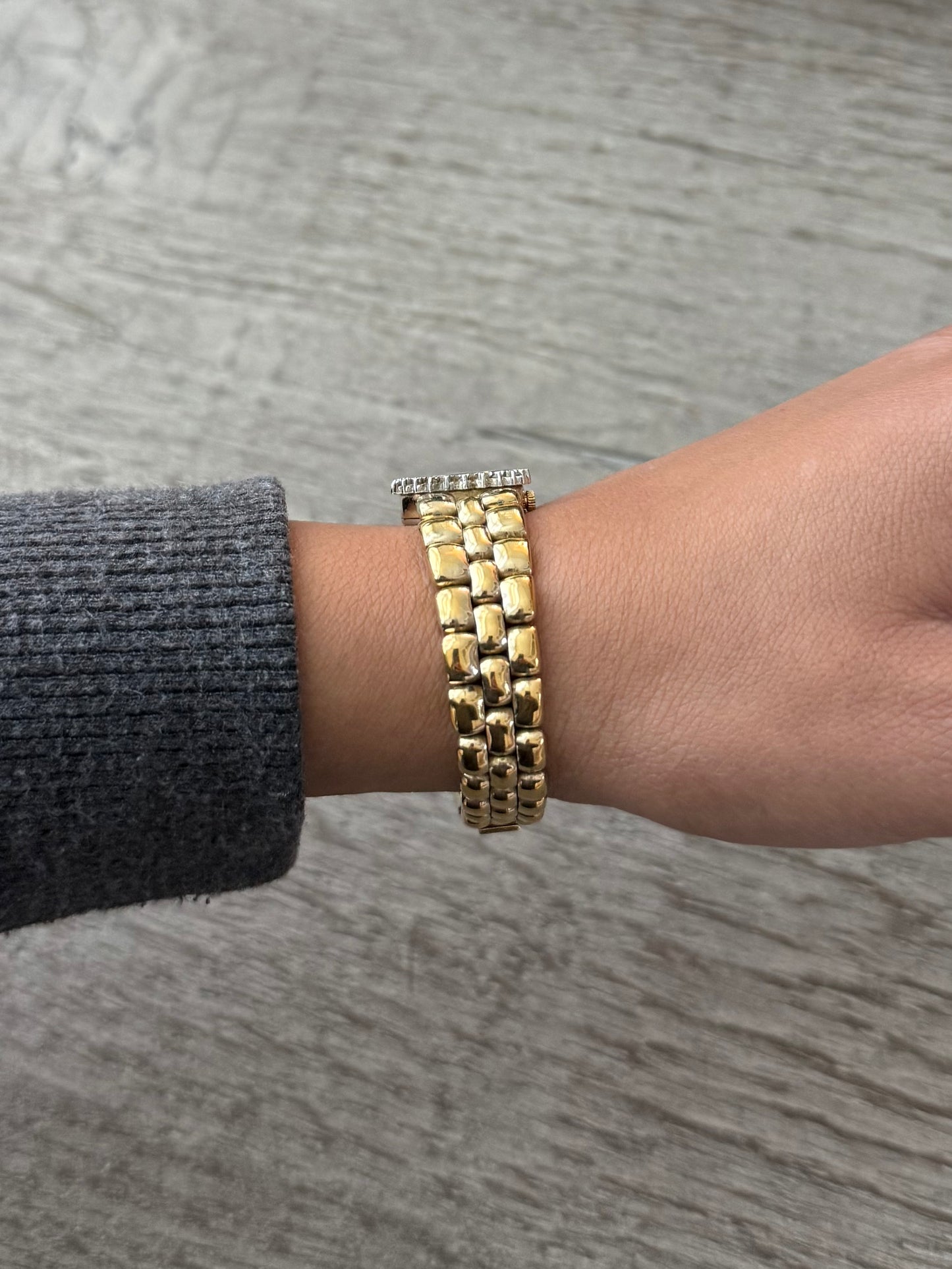 Gold Toned Armitron Dark Dial Watch with Crystal Bezel
